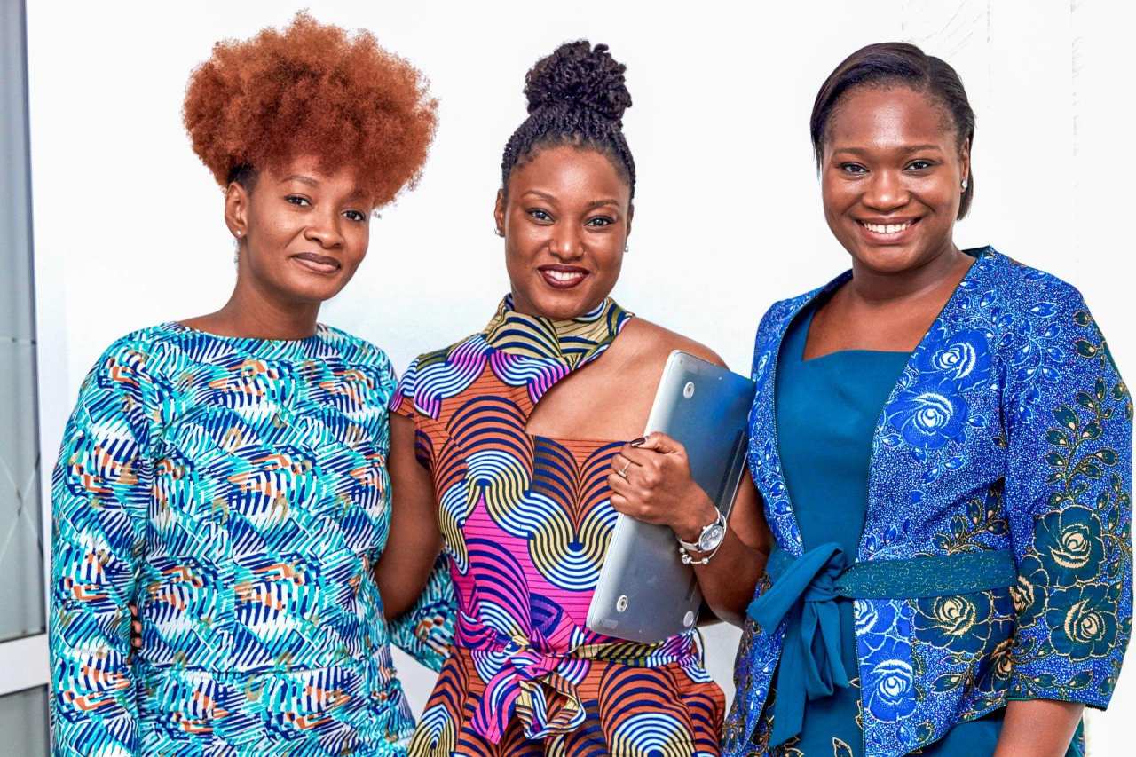 Three women standing together